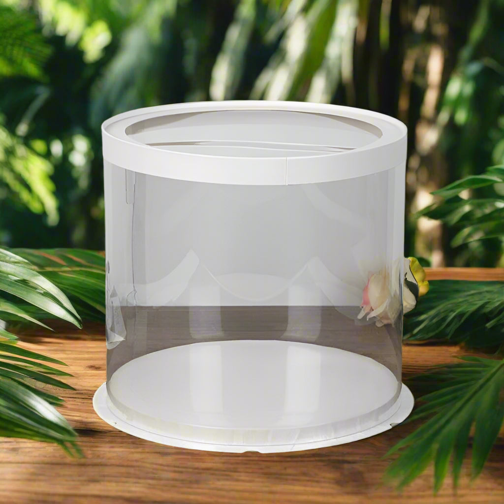 Clear cake stand with white base on a wooden surface